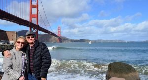 Couple in Front of Golden Gate Bridge on Sightseeing Tour with Dylan's Tours